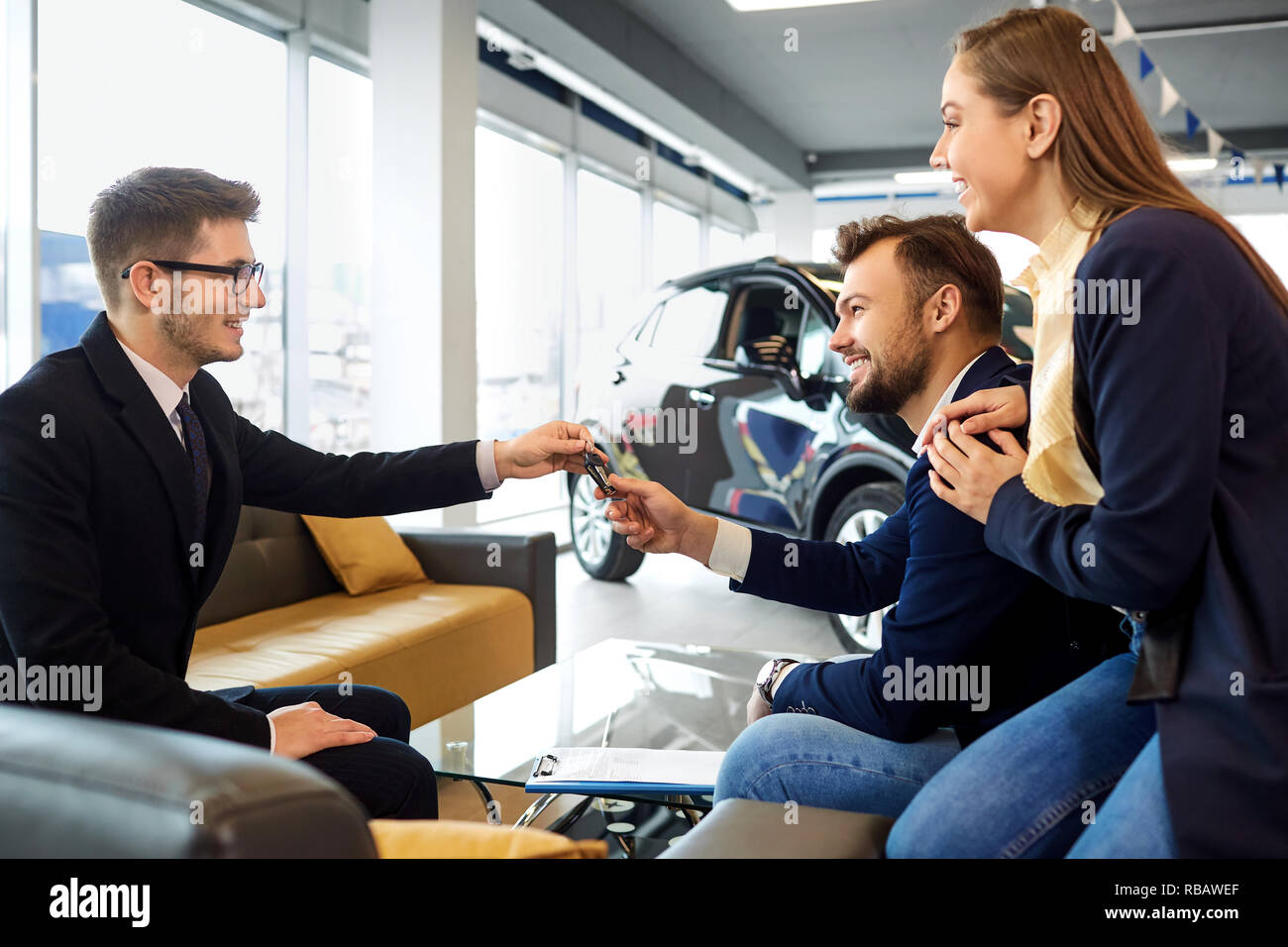 Couple buys a car in a car dealership Stock Photo Alamy
