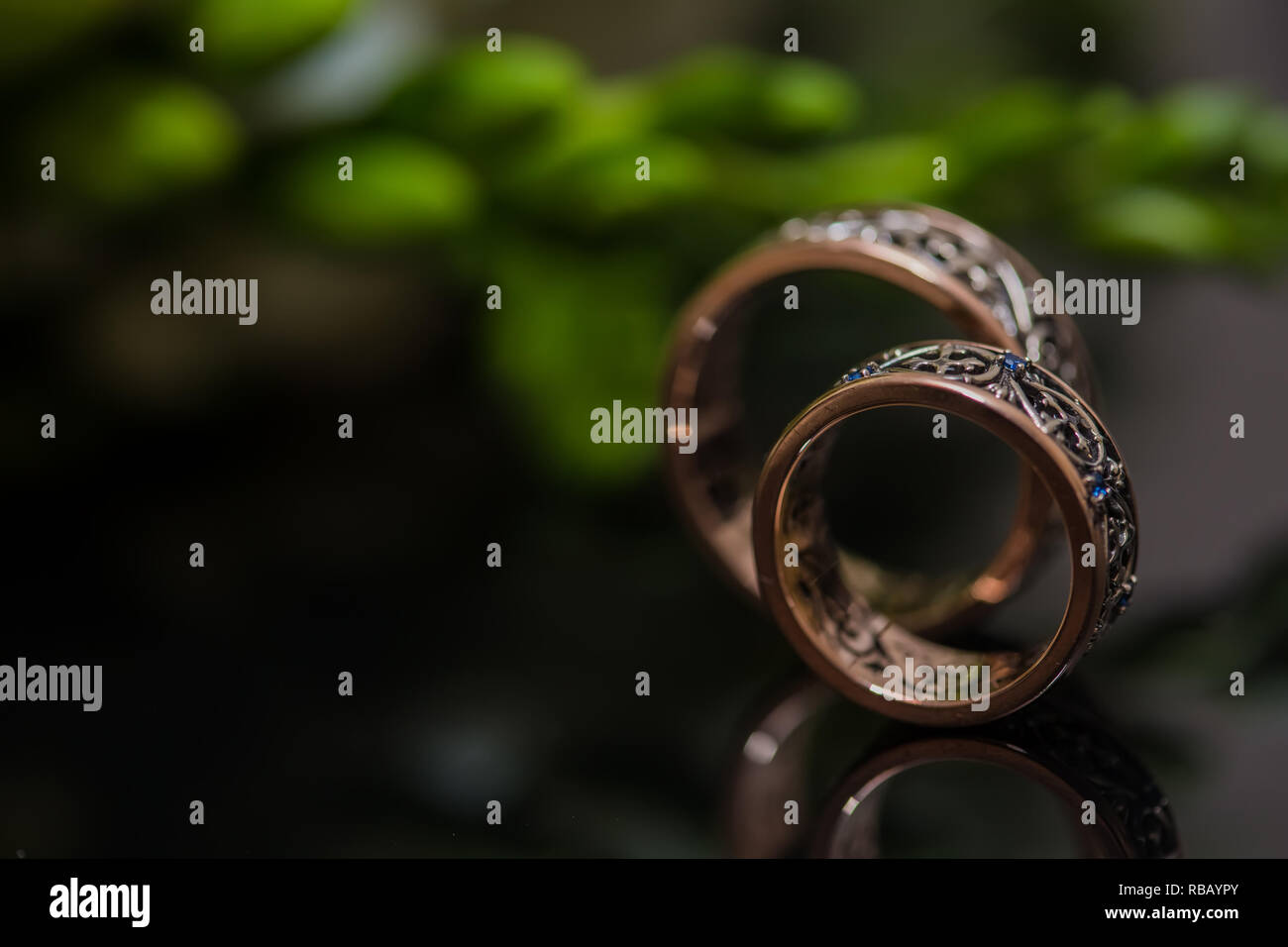 Two wedding rings in infinity sign. Love concept Stock Photo - Alamy