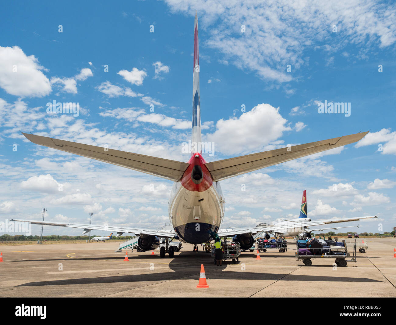 Traffic airliner on a runway. on Harry Mwanga Nkumbula International Airport in Livingstone, Zambia, Africa Stock Photo
