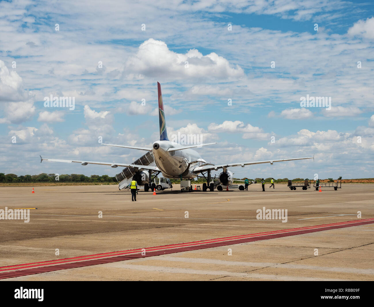 Traffic airliner on a runway. on Harry Mwanga Nkumbula International Airport in Livingstone, Zambia, Africa Stock Photo