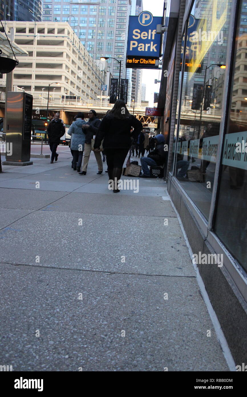 Standard and authentic urban scenery of a homeless street person