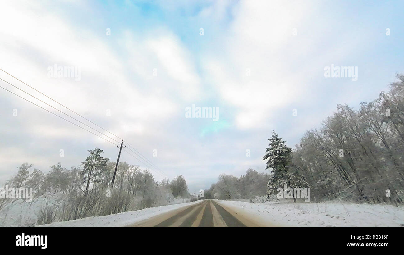 Country road in winter along the forest with white snow trees Stock ...