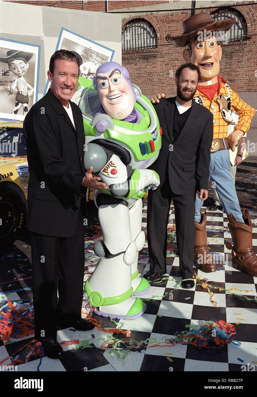 23OCT99: Actors TIM ALLEN (left) & TOM HANKS with 'Toy Story' characters 'Buzz Lightyear' & 'Woody' whose voices they portray in the films. They were at a promotion in Hollywood to unveil three NASCAR racing cars themed to 'Toy Story 2' which opens next month.        © RTSmith / MediaPunch Stock Photo