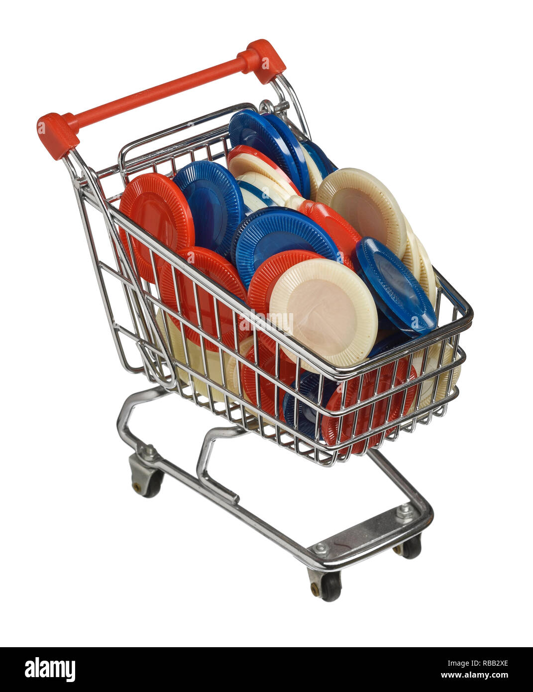 Mini shopping trolley filled with coloured plastic poker chips Stock