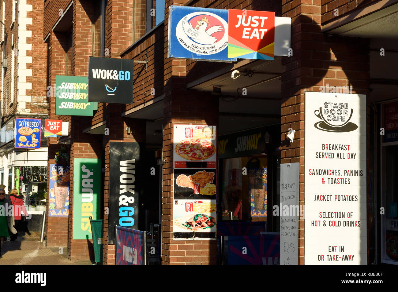 Multiple signs for takeaway food restaurants in Chester, UK Stock Photo