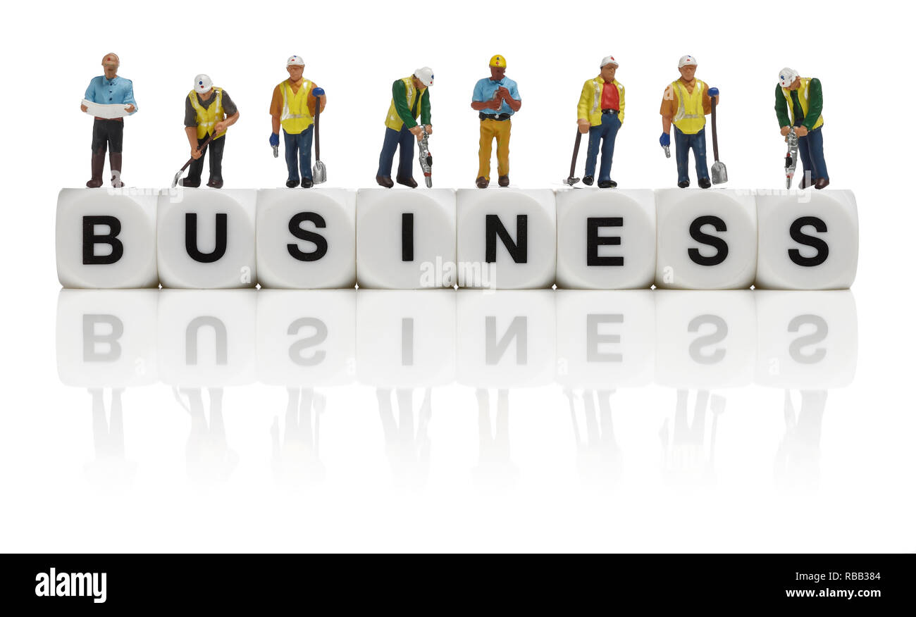 Construction workers and the word business Stock Photo
