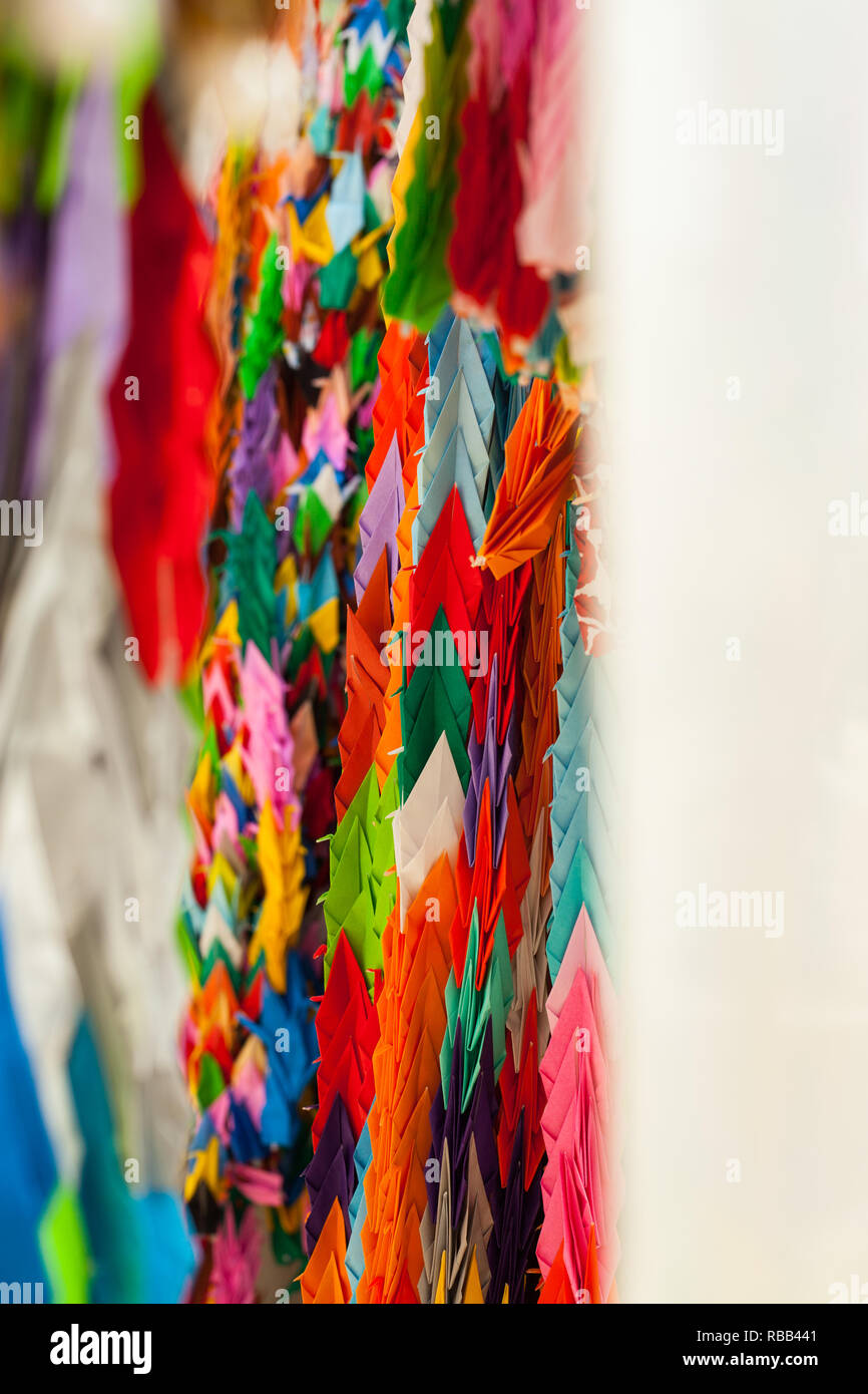 Colourful origami cranes on display in peace park hiroshima japan. Stock Photo
