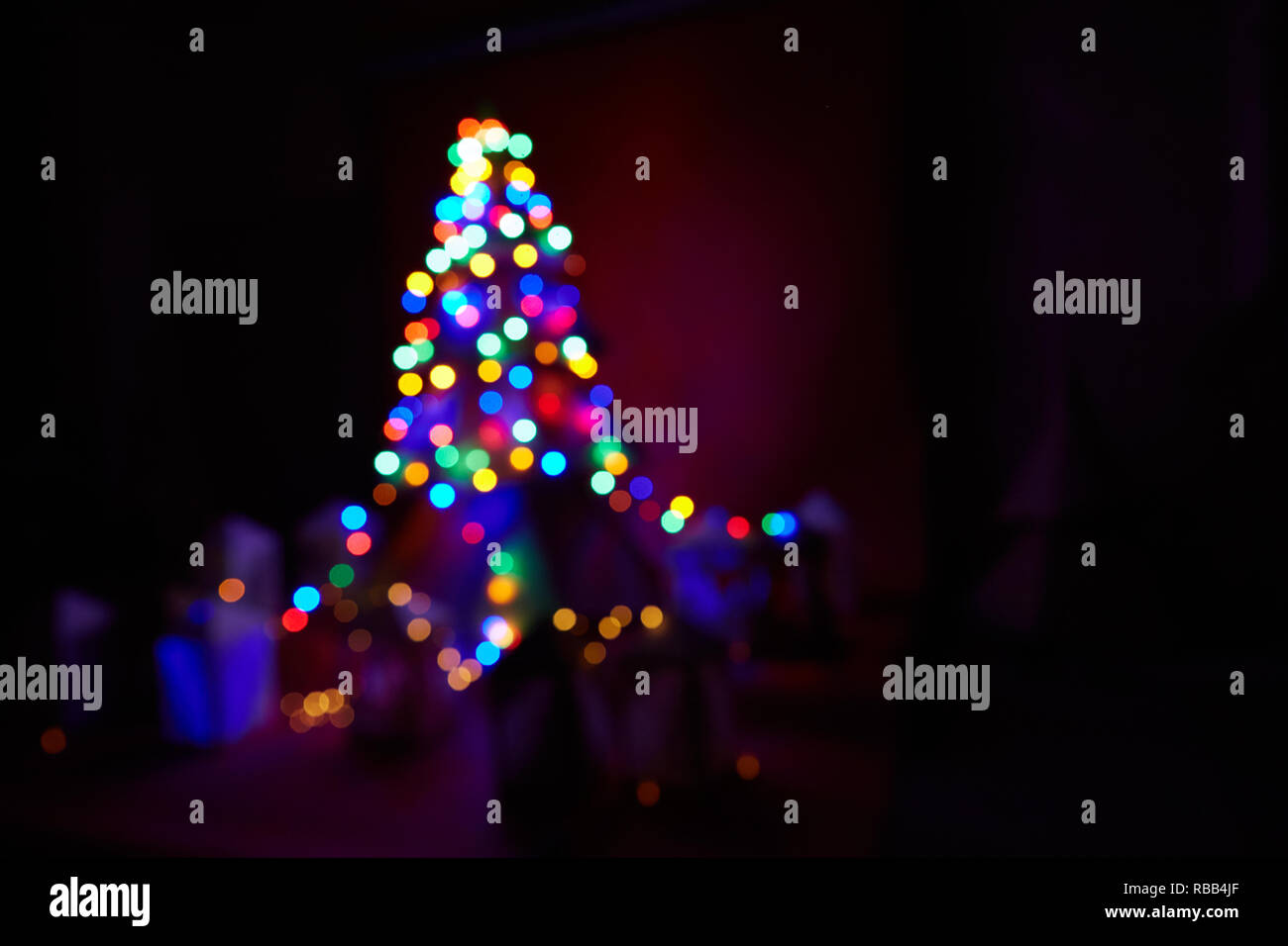 Christmas home room with tree and festive bokeh lighting, blurred ...