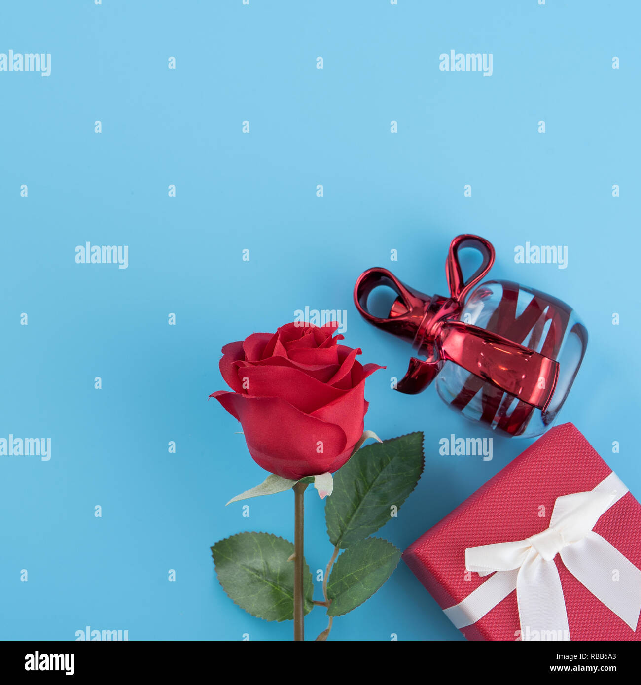Red gift box with white ribbon bow and rose, concept of Valentine's day ...