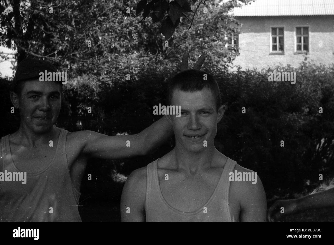 MOSCOW REGION, RUSSIA - CIRCA 1992: Portrait of soldiers of the Russian army in a sleeveless shirt. Film scan. Large grain. Stock Photo