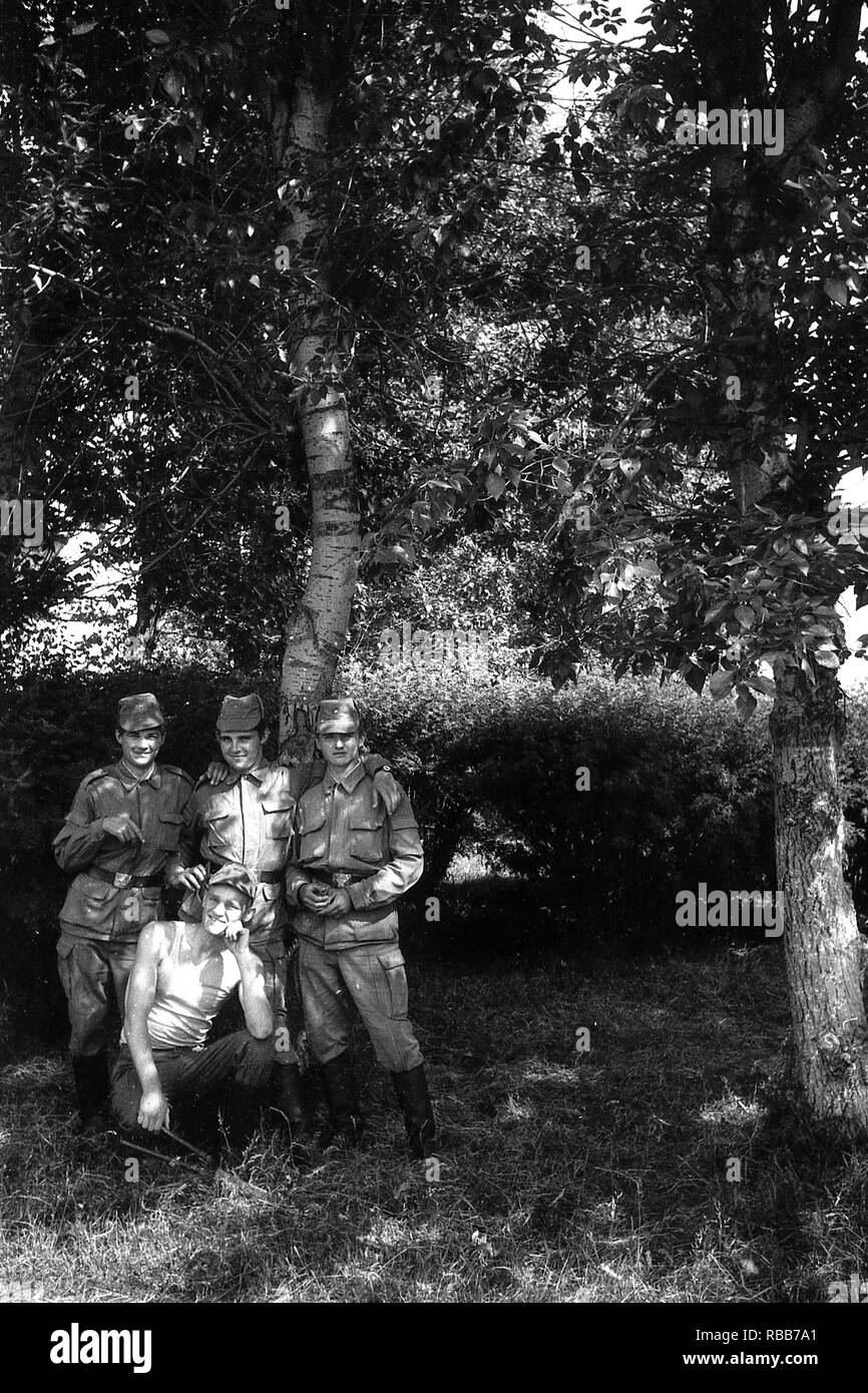 MOSCOW REGION, RUSSIA - CIRCA 1992: Portrait of soldiers of the Russian army. Film scan. Large grain. Stock Photo