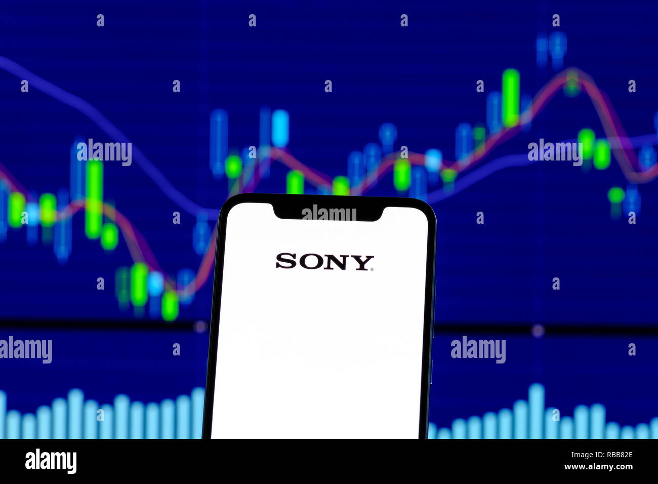 Sony logo is seen on an smartphone over stock chart Stock Photo