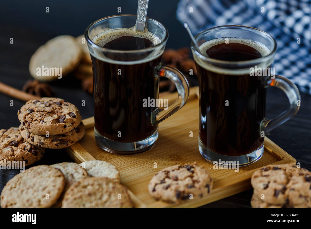 Two cups of coffee and chocolate and oatmeal cookies Stock Photo