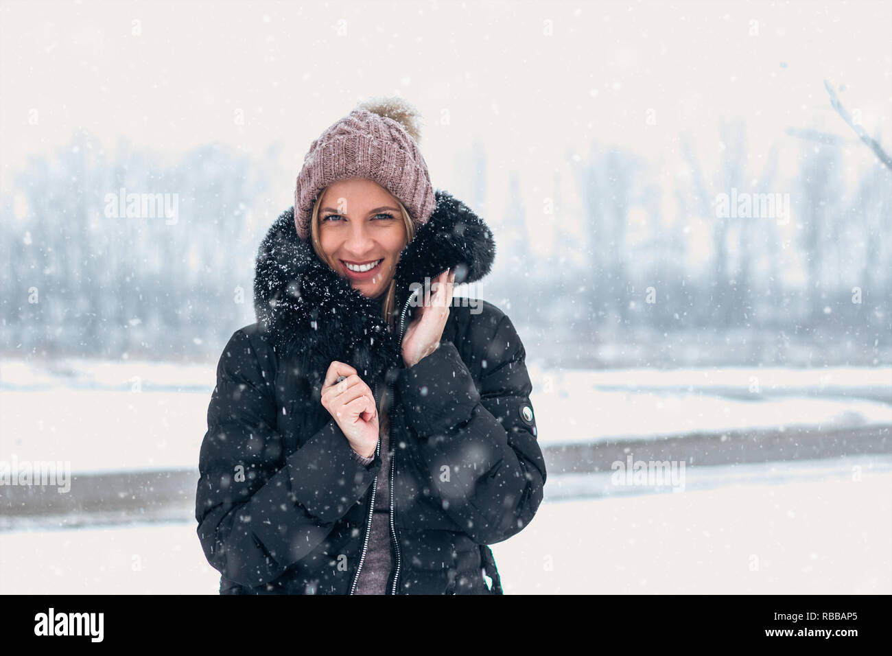 Cheerful woman outdoor in Winter cloathing Stock Photo - Alamy
