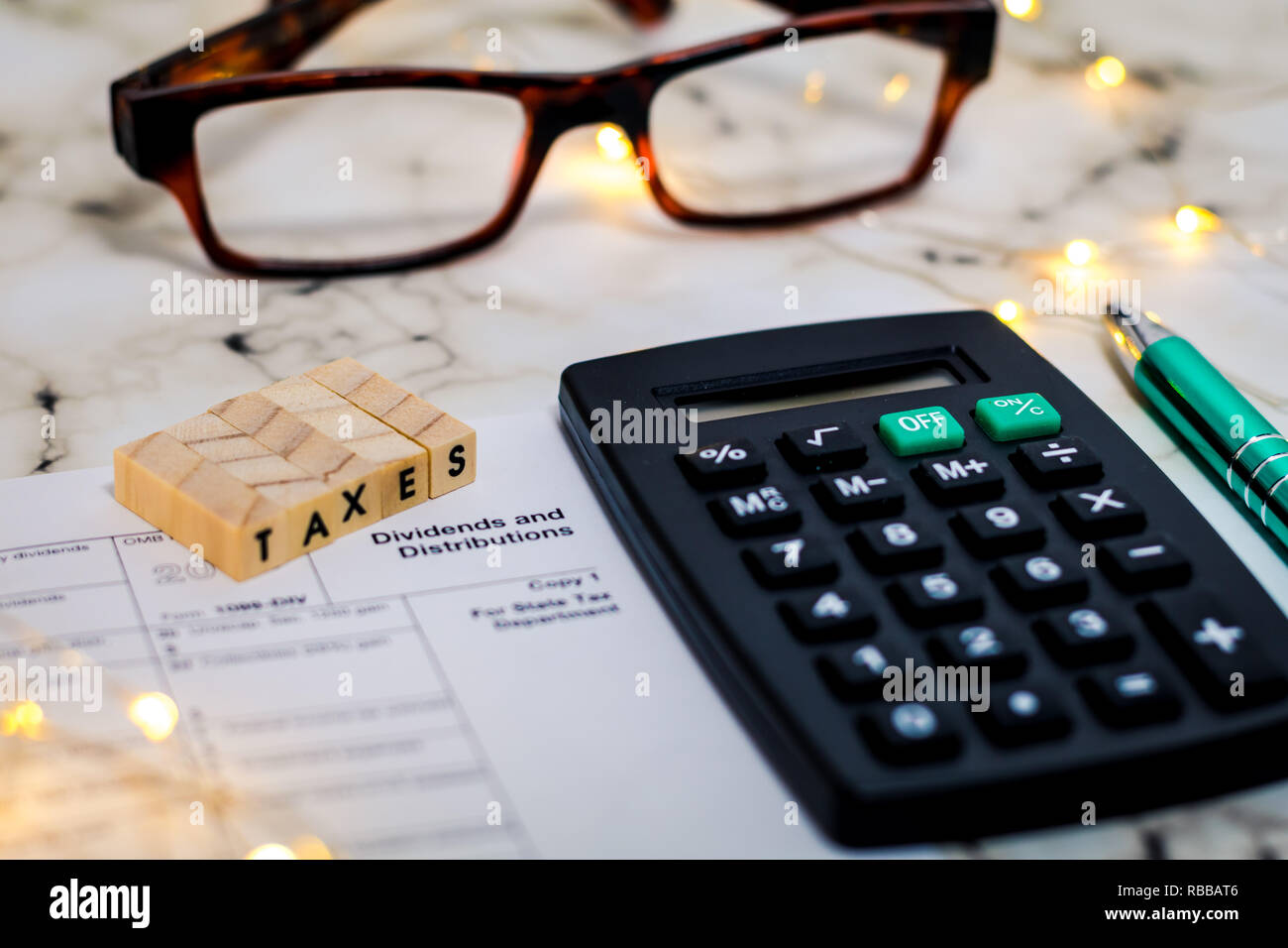 Taxes still life business finance concept, tax form, with calculator, pen shallow DOF Stock Photo