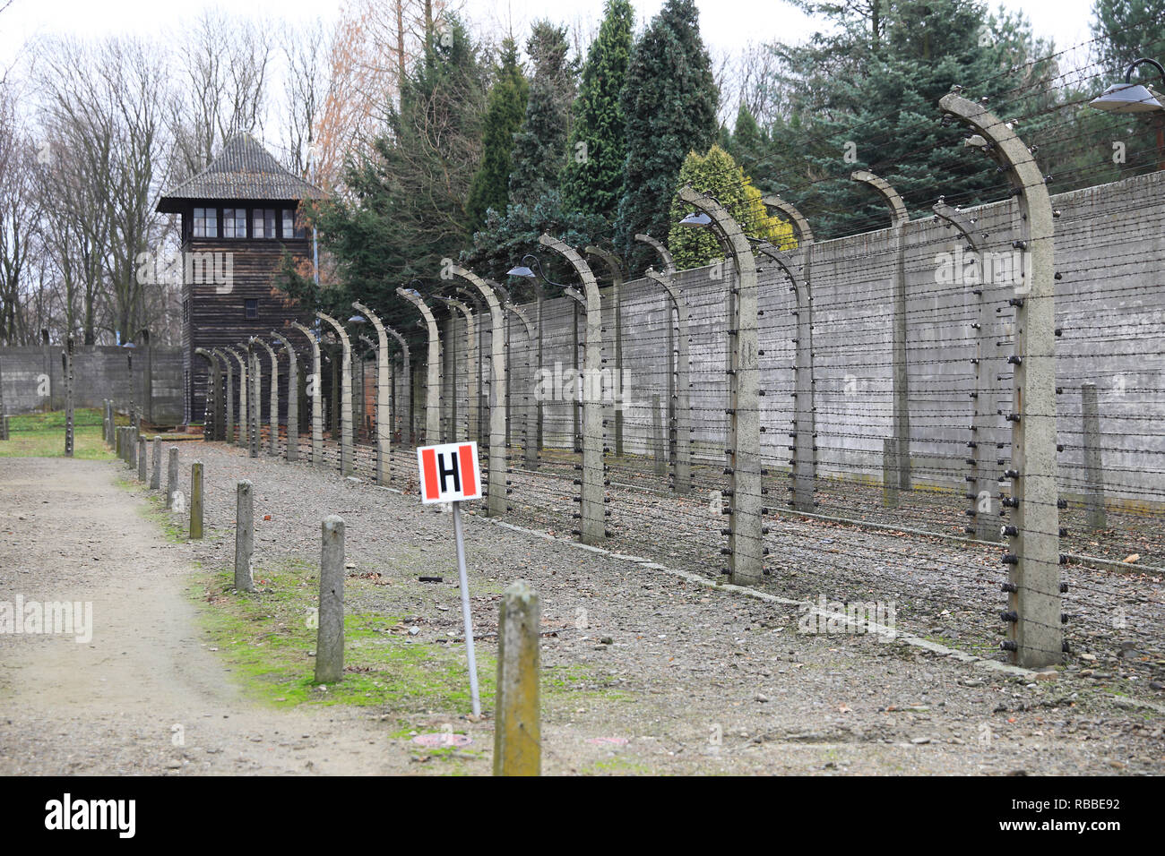 The grim watchtowers and fences of Auschvitz 1 concentration camp, now a UNESCO national Heritage Site, in Poland Stock Photo