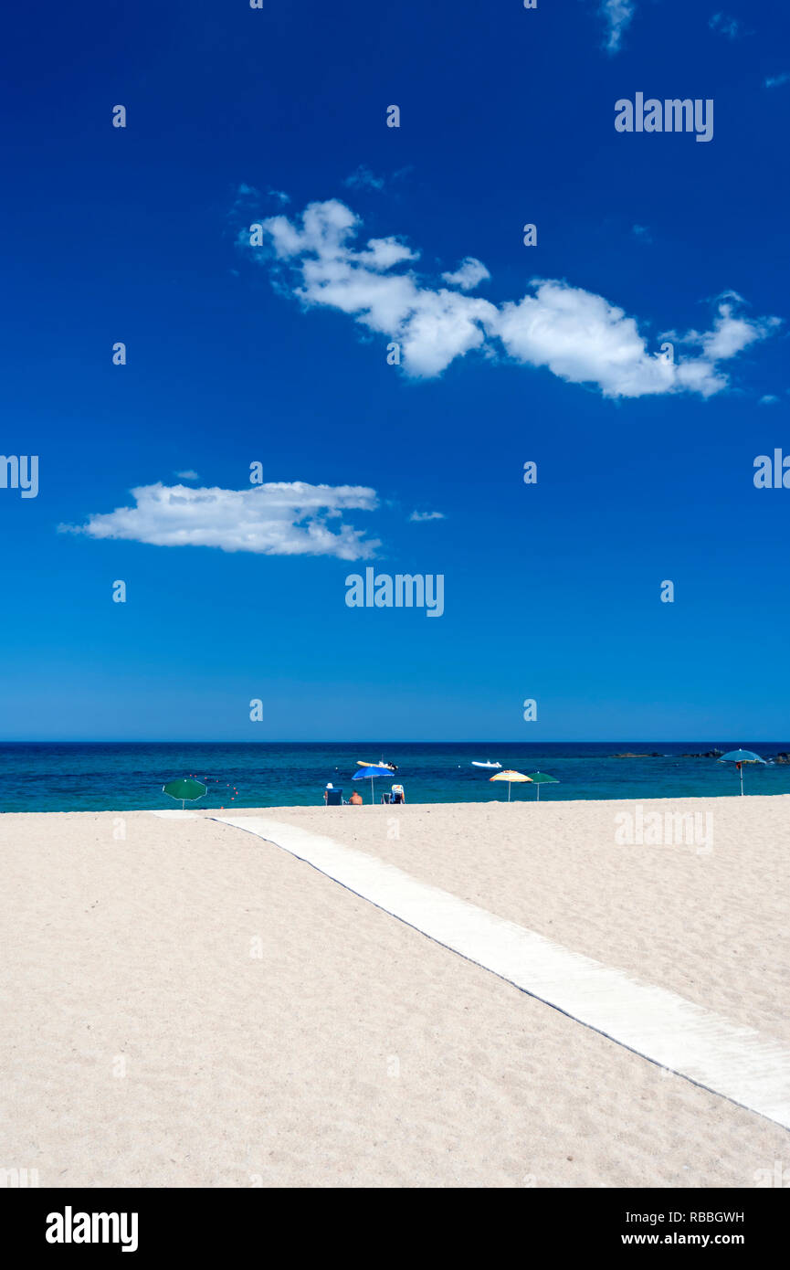 Beach on Sardinia island, Italy, with deep blue sky. Stock Photo