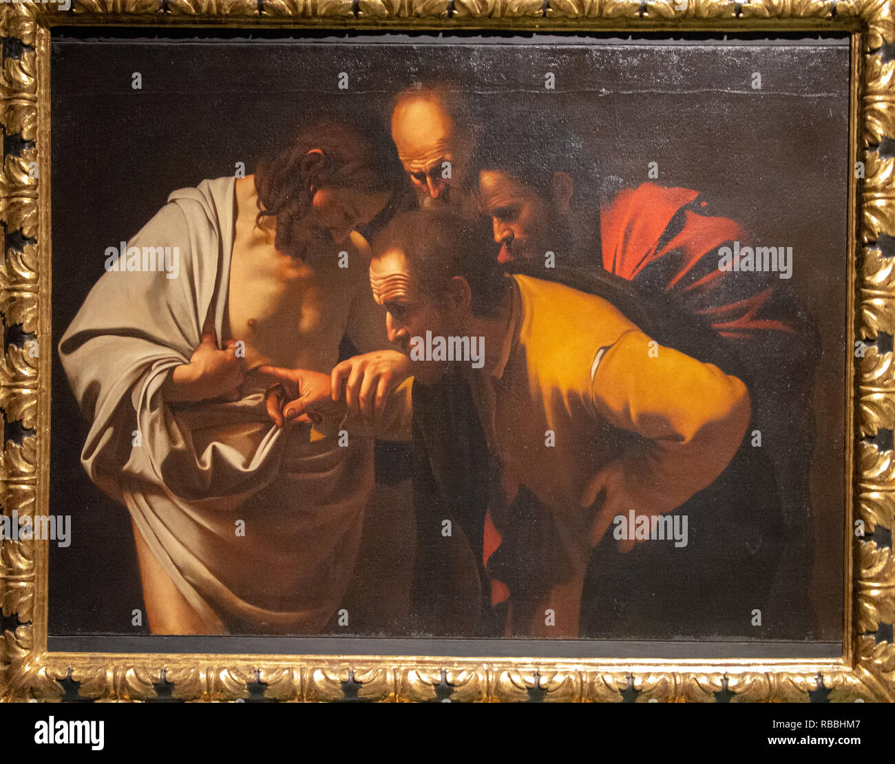 'The incredulity of Saint Thomas' by Michelangelo Merisi / Caravaggio Stock Photo