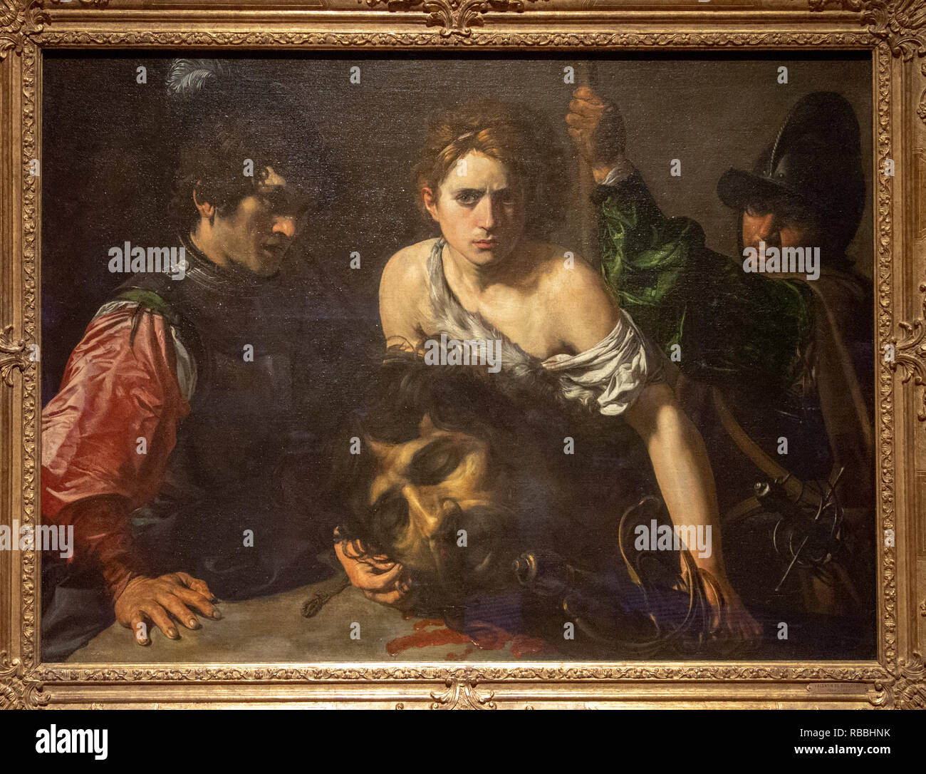'David with the head of Goliath and two soldiers' by Valentin de Boulogne Stock Photo