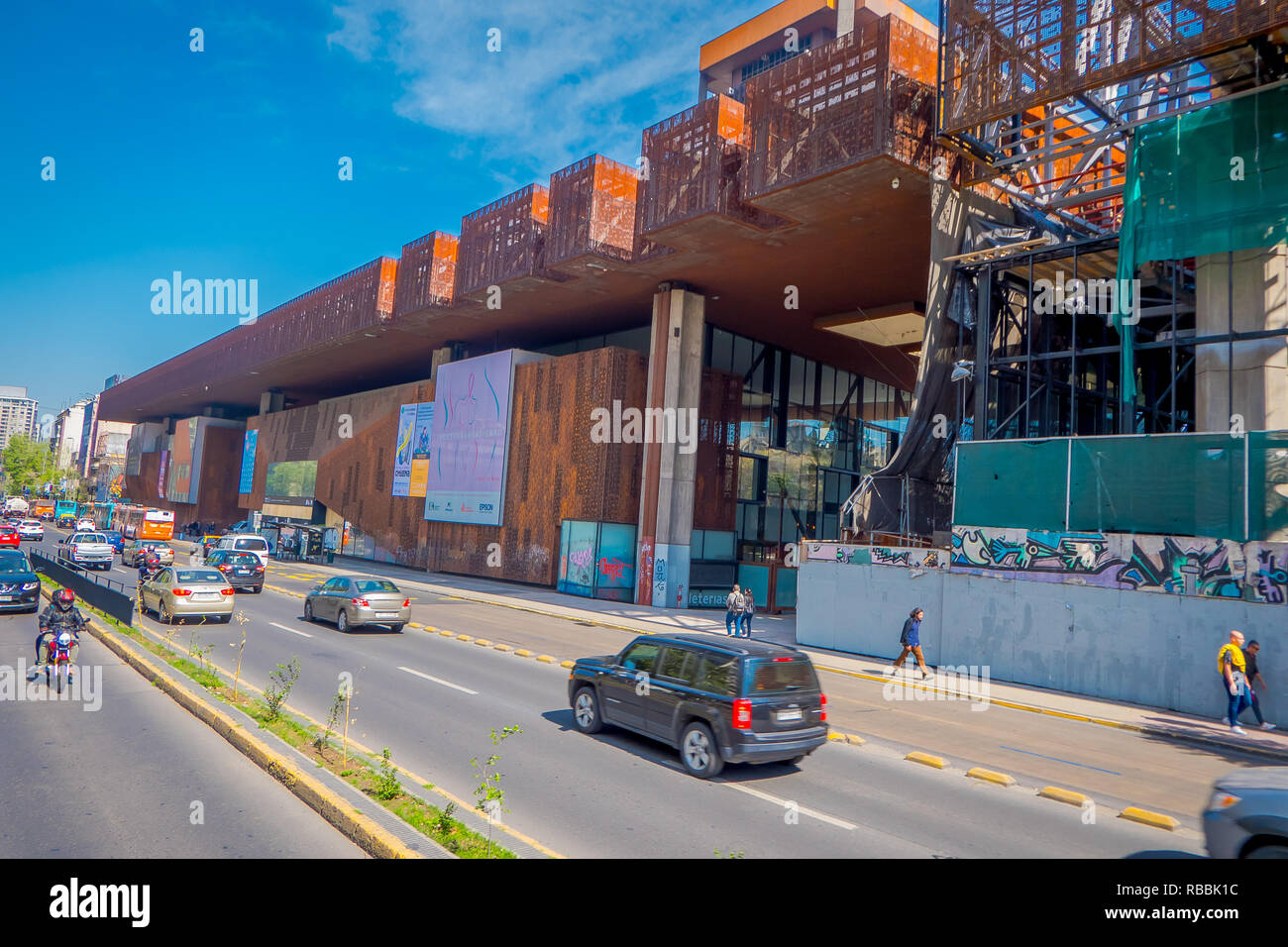 SANTIAGO, CHILE - OCTOBER 16, 2018: Traffic in front of construction of metallic building in honor to Gabriela Mistral in Santiago, Chile, the poet won the Nobel Prize for Literature in 1945 Stock Photo