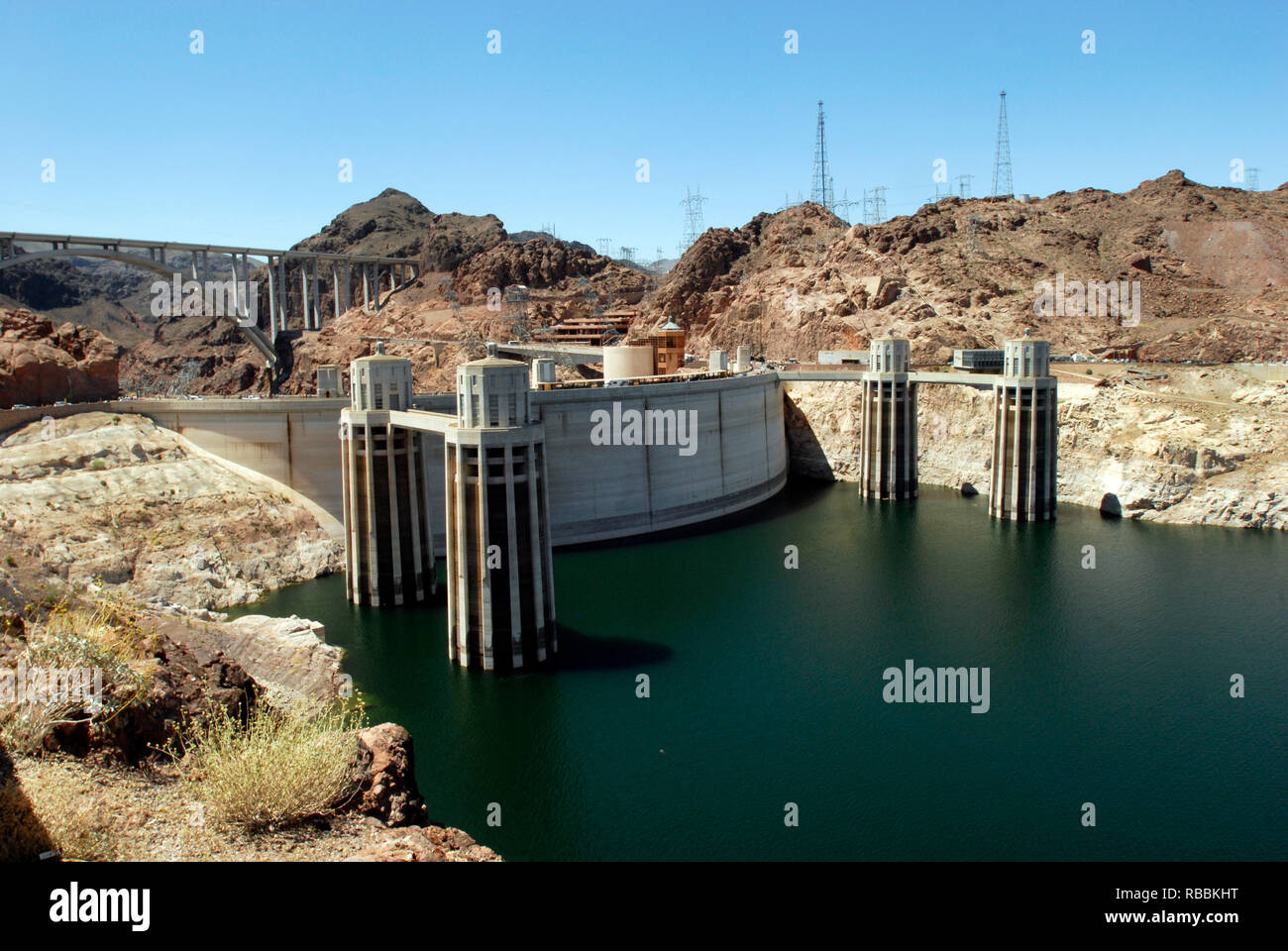 The intake towers behind the Hoover Dam, on the Arizona-Nevada border. The Mike O'Callaghan–Pat Tillman Memorial Bridge stands in the background. Stock Photo