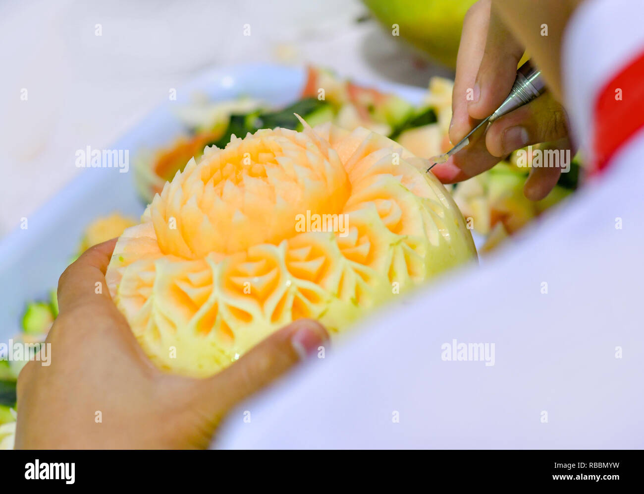 Thai fruit carving with hand, Vegetable and Fruit Carving Stock Photo