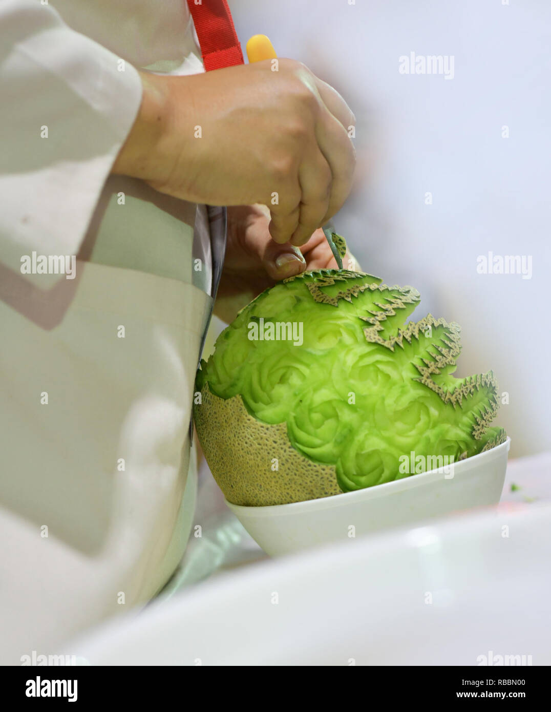 Thai fruit carving with hand, Vegetable and Fruit Carving Stock Photo