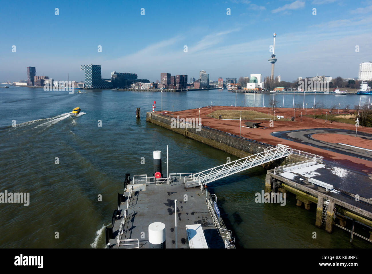 Second Katendrecht harbor in Rotterdam with a view of the Euromast. Tweede Katendrechtse haven in rotterdam met zicht op de Euromast. Stock Photo