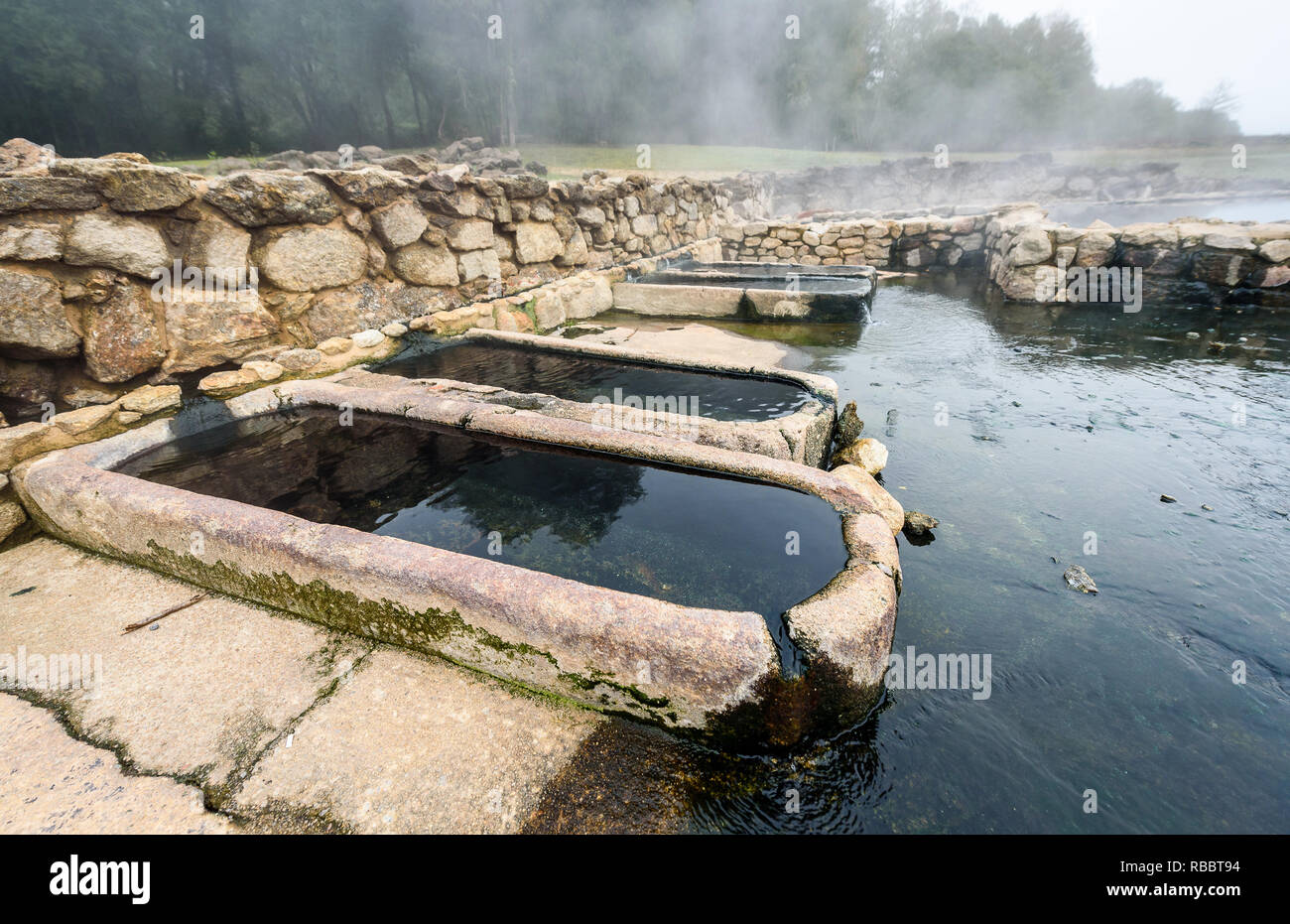 Natural Roman Baths Outdoors With Hot Steam And Thermal Water Old
