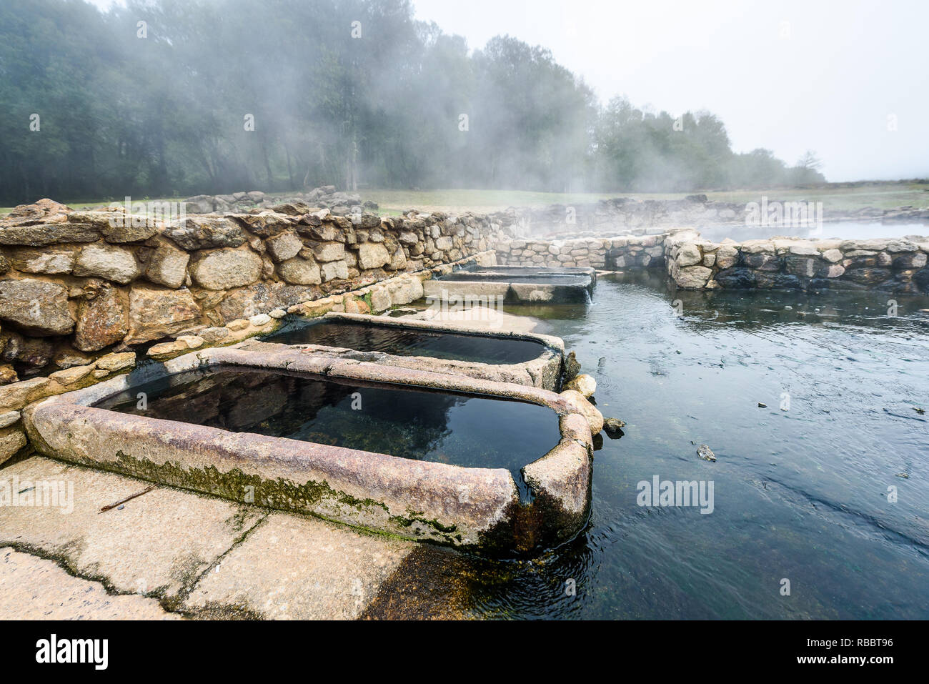 Natural Roman Baths Outdoors With Hot Steam And Thermal Water Old