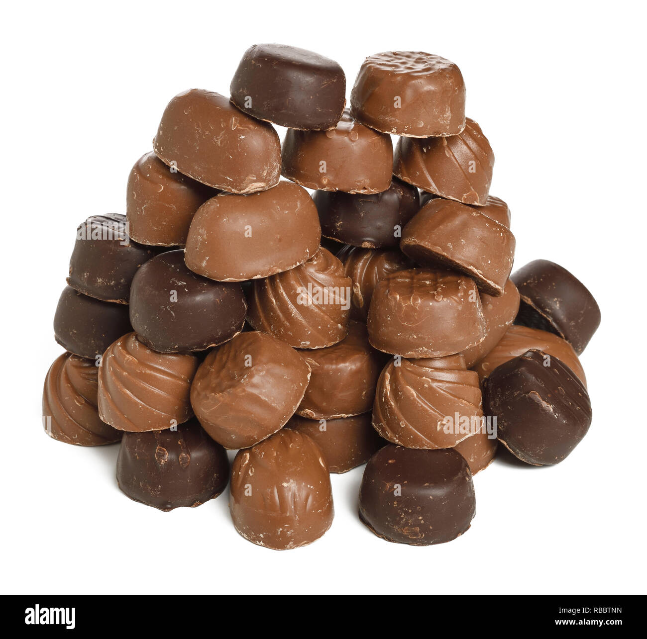 A pile of unwrapped chocolate sweets Stock Photo
