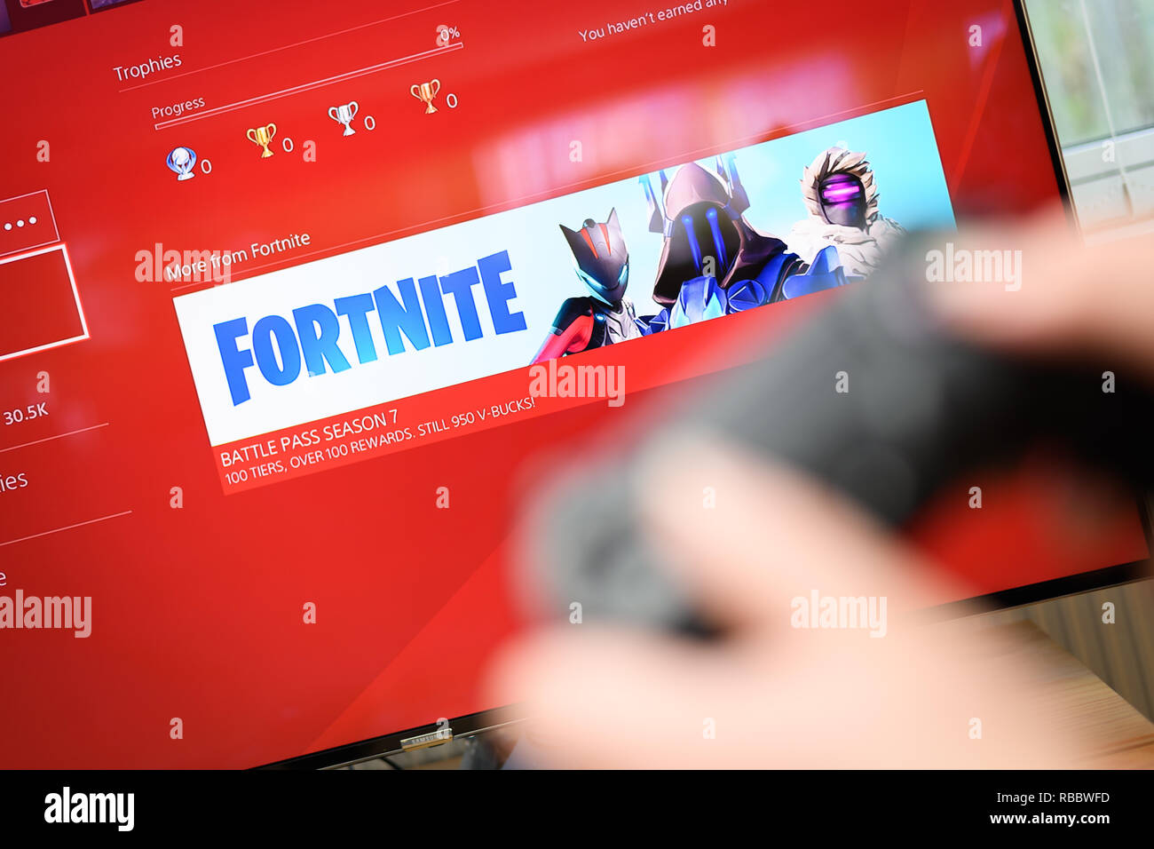 Cardiff, Wales - January 09, 2019:  Fortnite video game on PlayStation menu, Fortnite is a web based multi player survival game developed by Epic Game Stock Photo