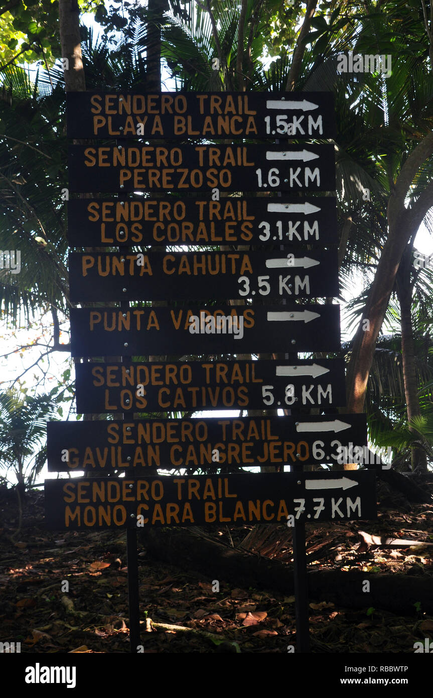 The signs at Cahuita National Park listing the Trails and the distance to where they are Stock Photo