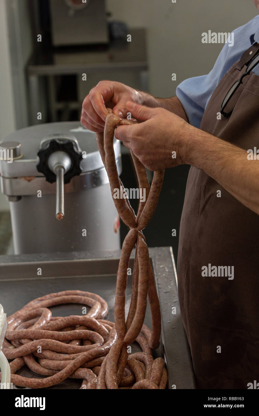 Butcher preparing gluten free sausages at the Gog Farm Shop, Stapleford, Cambridge, Cambridgeshire Stock Photo