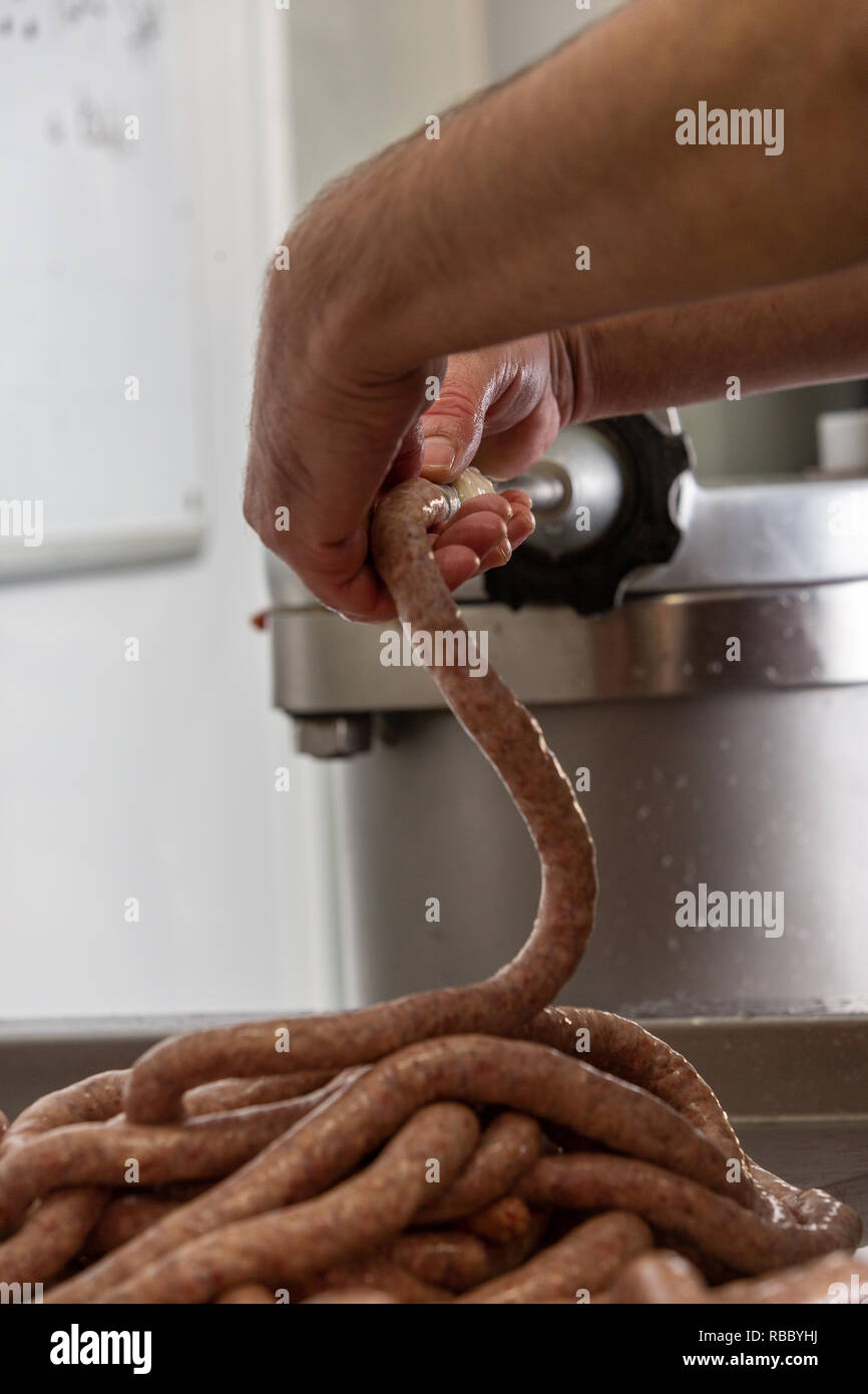 Butcher preparing gluten free sausages at the Gog Farm Shop, Stapleford, Cambridge, Cambridgeshire Stock Photo