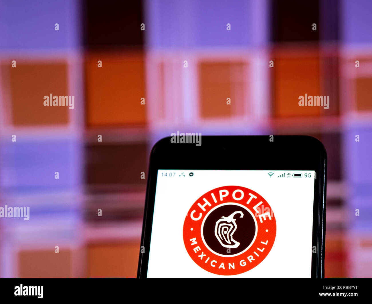 Chipotle Mexican Grill Restaurant company logo seen displayed on smart ...