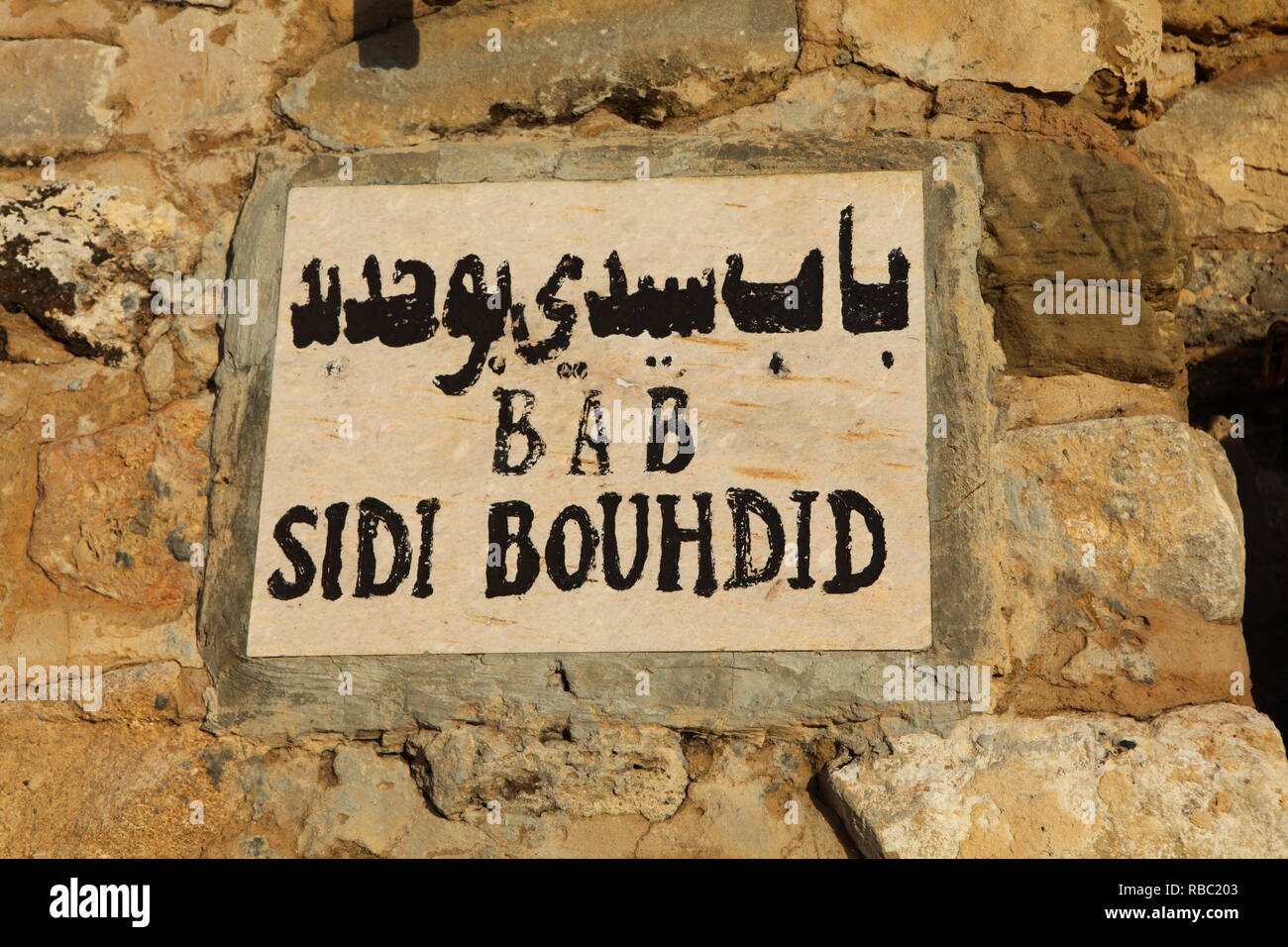 Bab Sidi Bouhid street and sign, written in two different letters in Hammameth Medina. Stock Photo