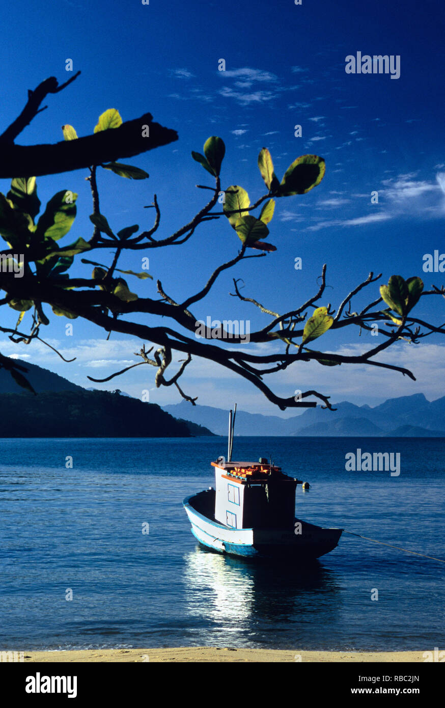 Scenic view of blue sea and fishing boat, Ilha Grande, Brazil Stock Photo