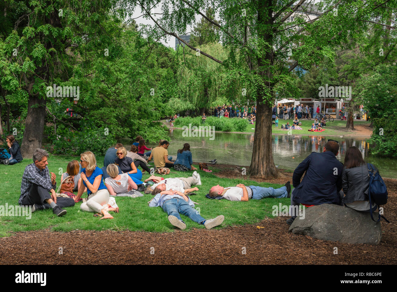 Vienna summer park, view of Viennese friends relaxing on a summer Sunday afternoon in the Stadtpark in Vienna, Wien, Austria. Stock Photo