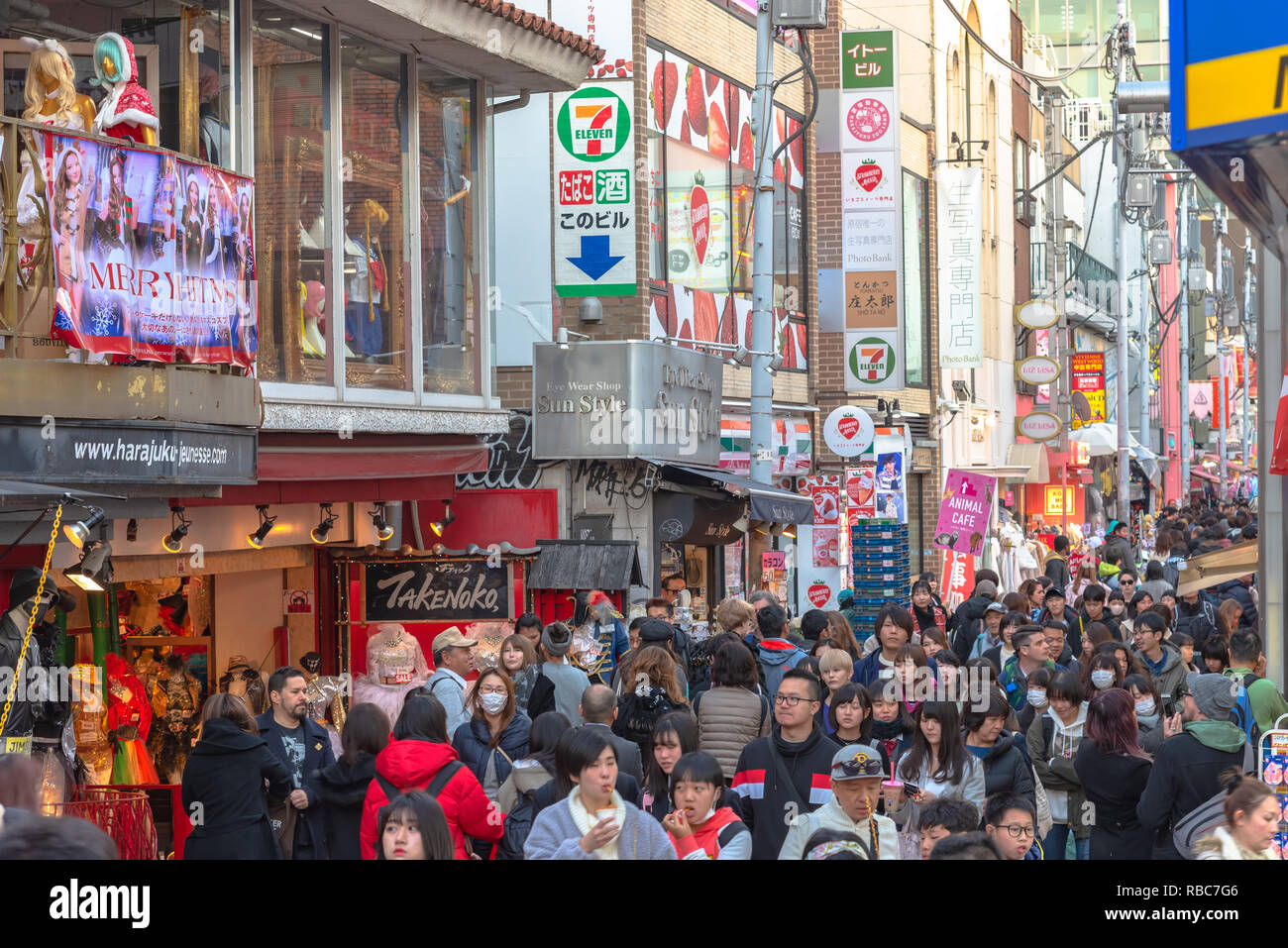 Harajuku street view. People, mostly youngsters, walk through Takeshita Street, a famous shopping street lined with fashion boutiques, cafes and resta Stock Photo