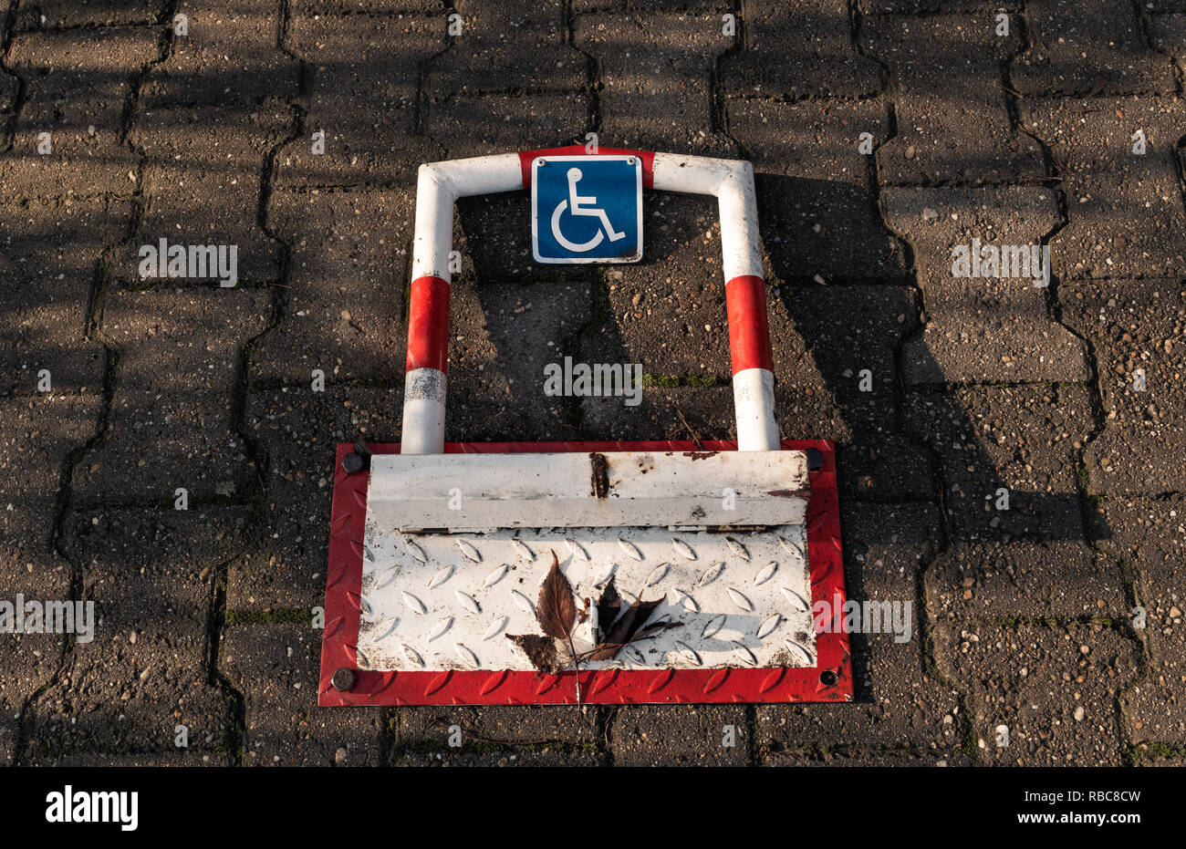 Disabled person parking space protector close up Stock Photo