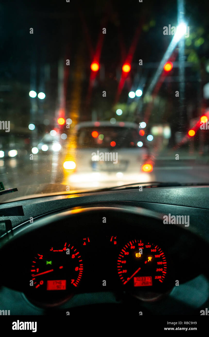 Car dashboard and window at night. Traffic lights Stock Photo Alamy