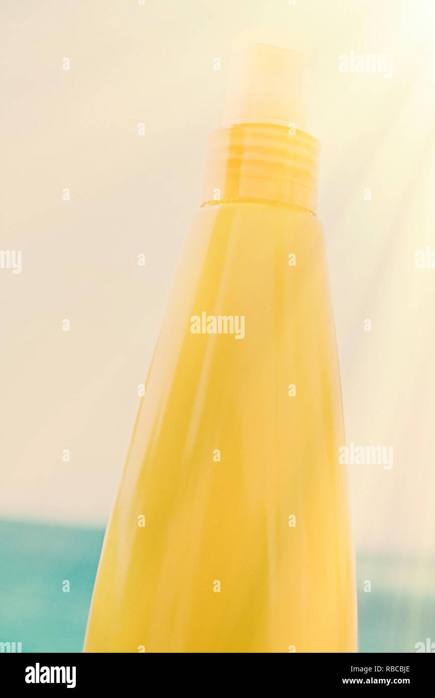 sun tan lotion on the beach - cosmetics, summer, holidays, skin and 