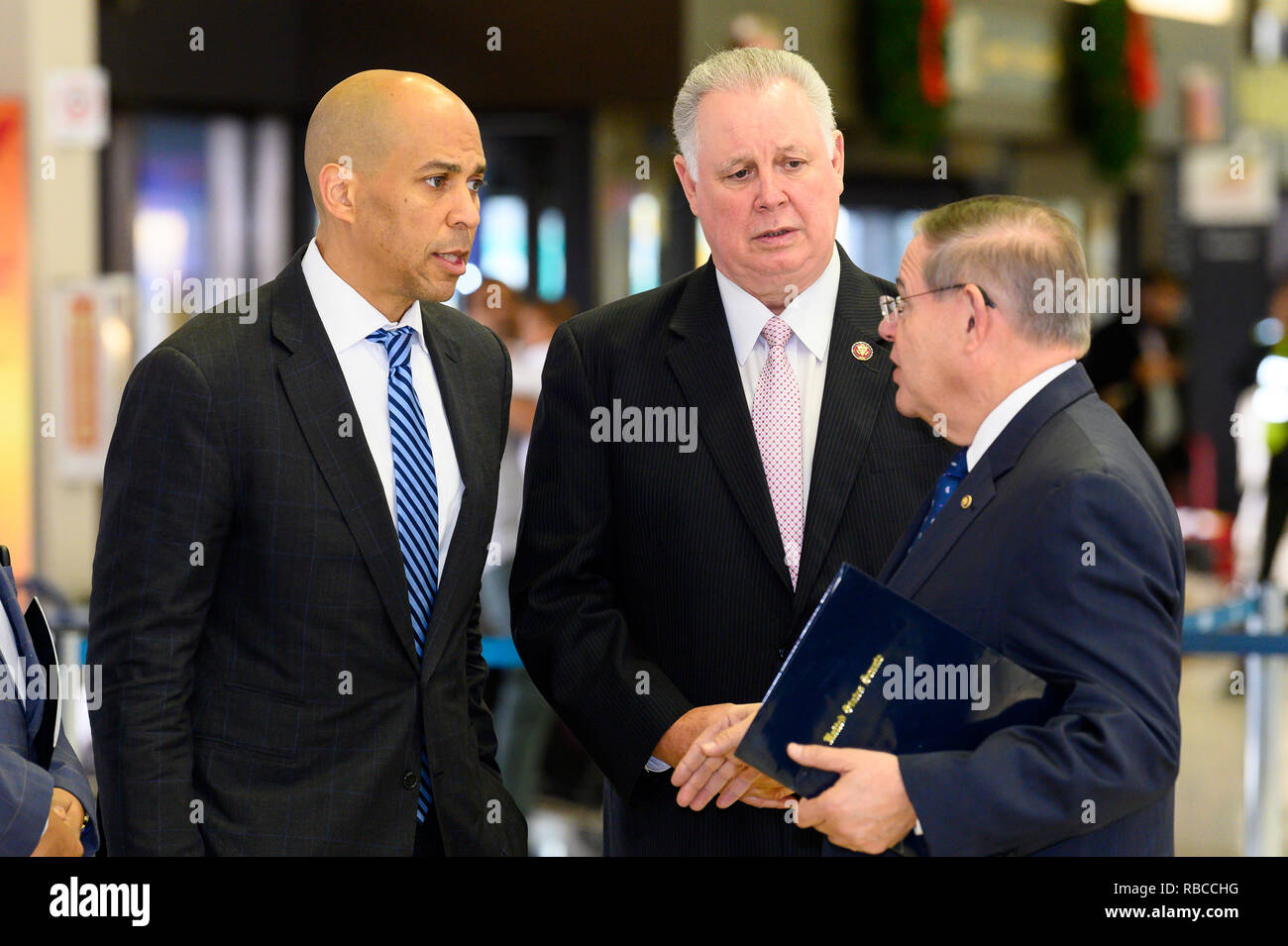 U.S. Senator Cory Booker (D-NJ), U.S. Representative Albio Sires (D-NJ) and U.S. Senator Bob Menendez (D-NJ) seen at a news conference at Newark Liberty International Airport to demand an end to the partial government shutdown leaving thousands of federal workers in New Jersey without pay and to highlight the impacts of lost services being felt statewide. At Newark Liberty International Airport in Newark, New Jersey on January 8,  2019. Stock Photo