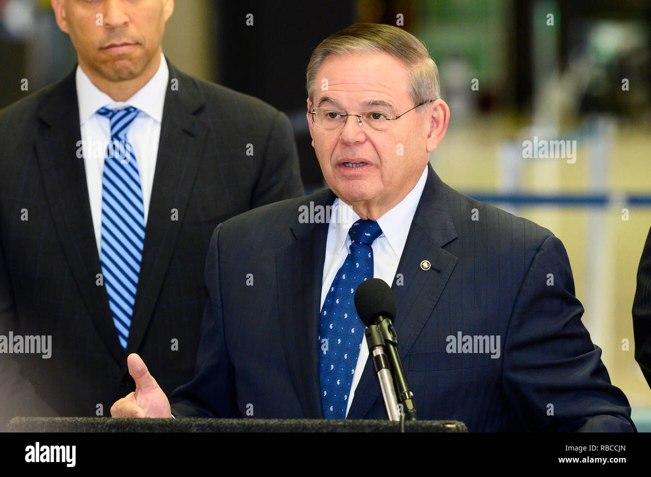 U.S. Senator Bob Menendez (D-NJ) seen speaking at a news conference at Newark Liberty International Airport to demand an end to the partial government shutdown leaving thousands of federal workers in New Jersey without pay and to highlight the impacts of lost services being felt statewide. At Newark Liberty International Airport in Newark, New Jersey. Stock Photo