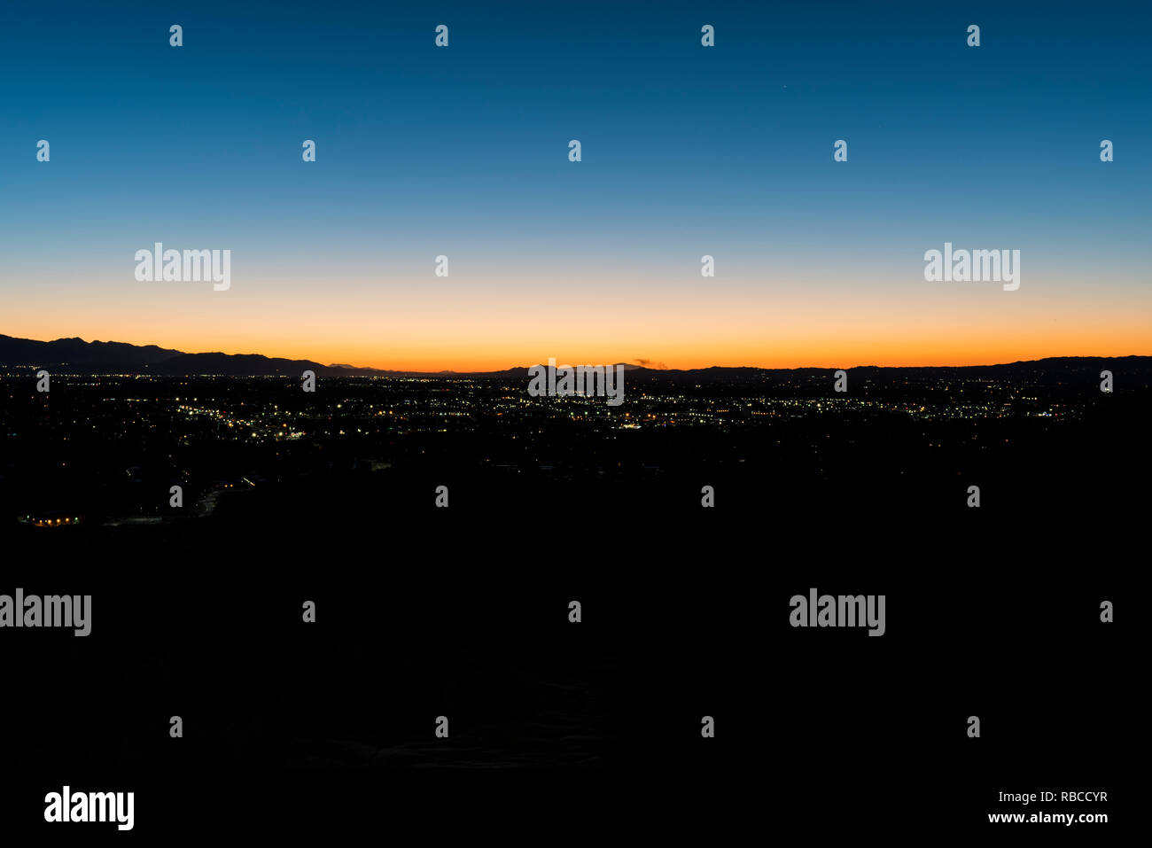 Predawn hilltop view of sprawling west San Fernando Valley neighborhoods in Los Angeles, California. Stock Photo