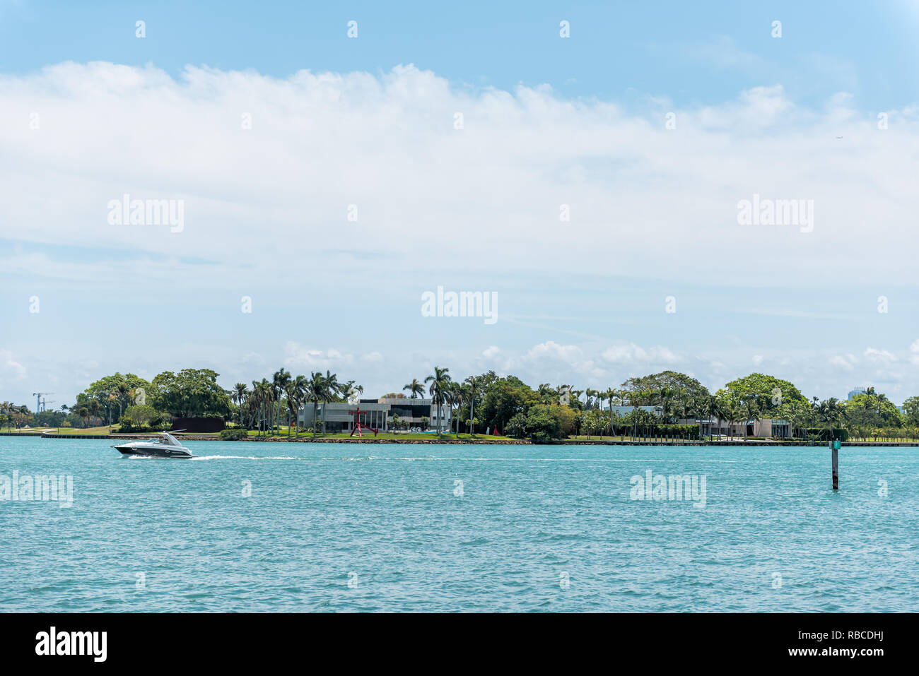 Bal Harbour, USA - May 8, 2018: Miami Florida with ocean Biscayne Bay Intracoastal water and view of Indian Creek Billionaire island with boat yacht Stock Photo