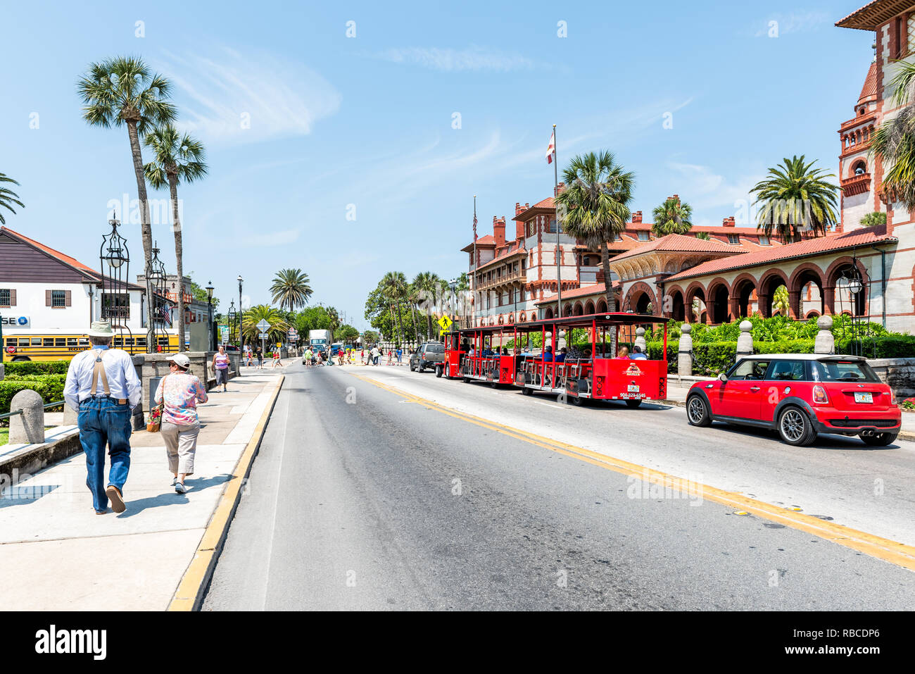 St Augustine Usa May 10 2018 Flagler College With Florida Architecture Famous Statue In Historic City And Red Train Trolley Tour Guide Tram Wi Stock Photo Alamy