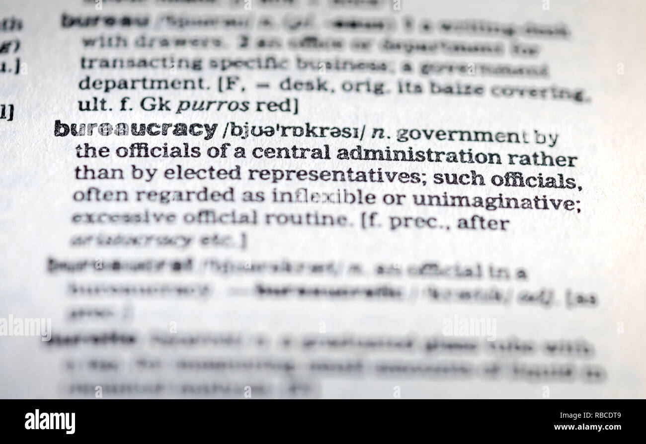 Close up of the word bureaucracy on a page inside an English dictionary - bureaucracy concept Stock Photo