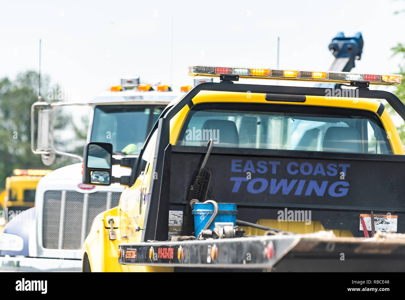 Raleigh, USA - May 13, 2018: Highway road in North Carolina with closeup of East Coast towing truck car by accident crash Stock Photo